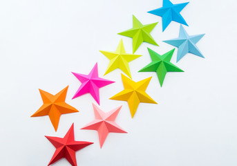 A star made of rainbow-colored paper