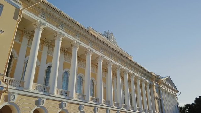 Russian Museum colomn view on a main building with sun setting down
