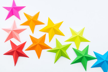 A star made of rainbow-colored paper