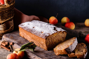 Homemade Apple Cinnamon Coffee Cake with fresh apples on old rustic wooden table. Selective focus