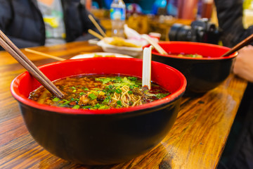 Bowl of hot and spicy chinese noodle soup, spicy ramen.