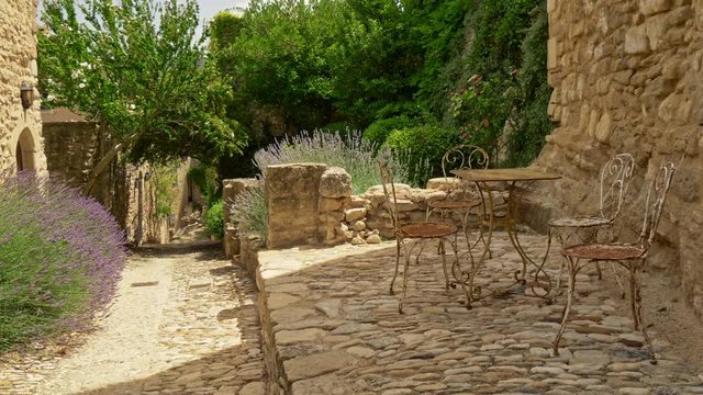 Walking down the street in Lacoste - a commune and medieval village in the southern France. 4K, UHD