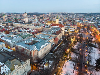Obraz premium aerial view of city in night time. streets in car lights.