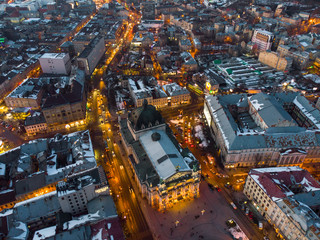 aerial view of city in night time. streets in car lights.