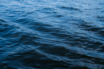 Background of deep blue river water surface.