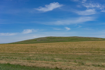 Fototapeta na wymiar Natural landscape with hills on blue sky background.