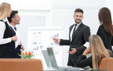 businessman makes a presentation to his business team