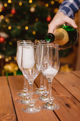 Christmas and New Year celebration with champagne. New Year holiday decor.