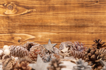Obraz na płótnie Canvas christmas frame background with pine cones
