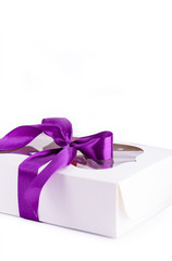 A box of delicious desserts. Eclairs with different fillings. Delicious desserts in the packaging box.