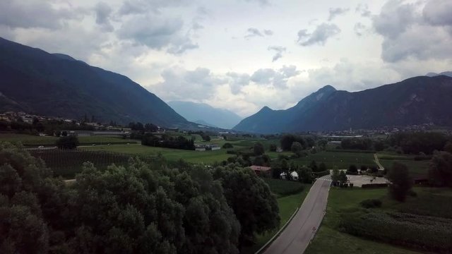Aerial panoramic view of Levico Terme, Italy, during sunrise with views of the mountains.