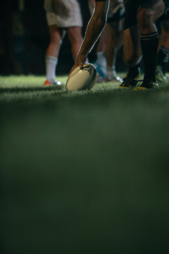 Rugby player touching down the ball