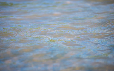 Surfaces and waves of naturally moving water.
