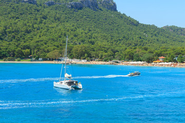 Fototapeta na wymiar Mediterranean Sea with yachts and motor boat in Antalya