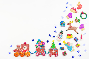 Naklejka premium Christmas background with decorations. Santa, Christmas train with tree and sweets, snowman, reindeer and gifts