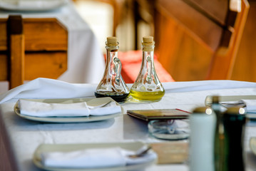 Olive oil and spices on the table in the restaurant 