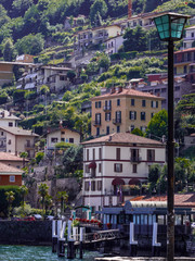 mountain village at Como Lake that slopes down to the lake, Italy