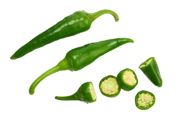 sliced green hot chili peppers isolated on white background top view