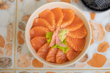 Salmon don - Bowl of steamed rice with salmon sashmi, Japanese traditional food.