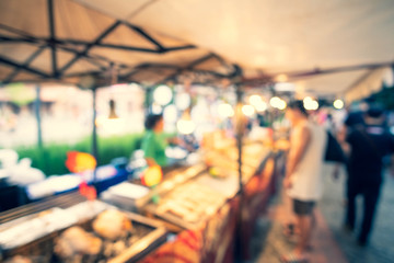 Abstract blur image of Street food in Night market with bokeh for background usage.