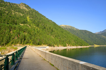 Lac de l'Oule dam in Neouvielle national nature reserve. French Pyrenees.