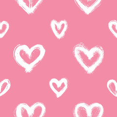 Seamless pattern with white hand-drawn uneven hearts isolated on pink background. Ink doodle style abstract grunge texture.