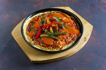 Omelette with paprika and zucchini. Rural breakfast.