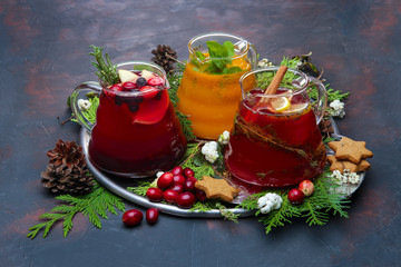 Christmas holiday hot drinks - concept of festive bar menu. Ginger, orange and cranberry tea.