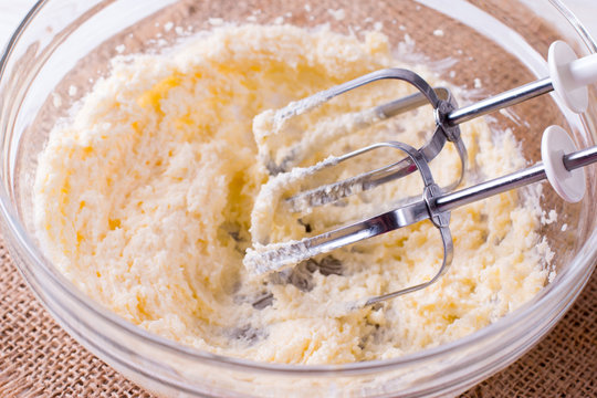 Homemade baking with the grunge auto hand mixer and ingredients of egg, sugar and butter