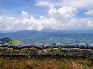 Fototapeta na wymiar Scenic view landscape of mountains and sandbag bunkers in chiangrai province border of Thailand and Myanmar.
