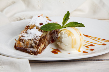 Slice of apple strudel with vanilla ice cream