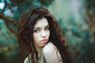 Naklejka premium Portrait of a beautiful girl in nature