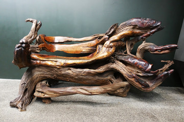 Abstract wooden bench made from tree trunk, isolated art object
