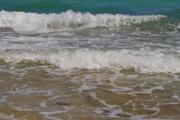 a beautiful beach with blue waters