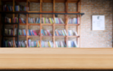 Selected focus empty old wooden table and .Library or Bookstore blur background with bokeh image. for your photomontage or product display