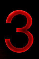 number three light neon on the wall