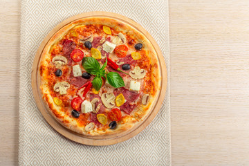 Pizza with Mozzarella, Ham, Cherry Tomatoes, Black Olives