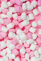 Marshmallows on pink background