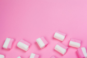 Marshmallows on pink background