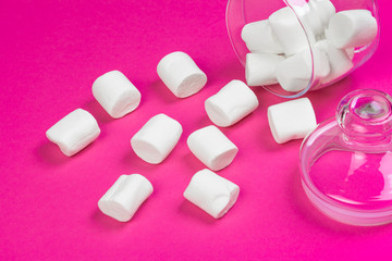 marshmallows on a pink background. top view