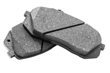 Brake pads isolated on white background. Auto parts. Brake pads isolated on white. Braking pads....