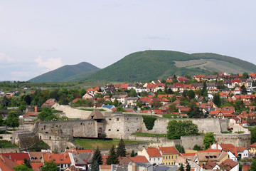 old fortress buildings and green hills landscape Eger Hungary