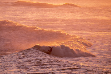 Early morning surfer, Taranaki New Zealand