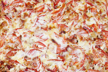 Oven baked potato with meat cheese and tomatoes. This is the endof the process of cooking meat in French style