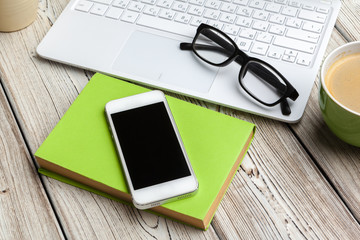 Top view office stuff with laptop and coffee