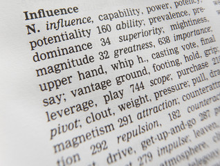 CLOSE UP OF DICTIONARY PAGE SHOWING DEFINITION OF THE WORD INFLUENCE