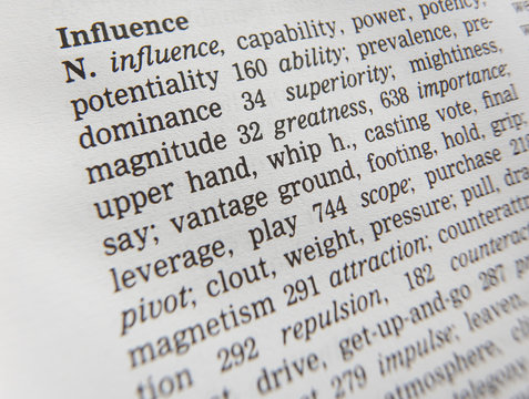 CLOSE UP OF DICTIONARY PAGE SHOWING DEFINITION OF THE WORD INFLUENCE