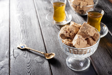 Tasty halva with tea on the table