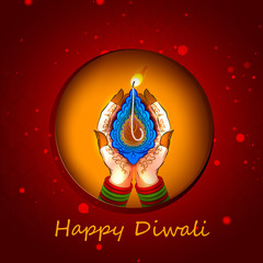 Lady holding diya for Happy Diwali celebration of India Holiday