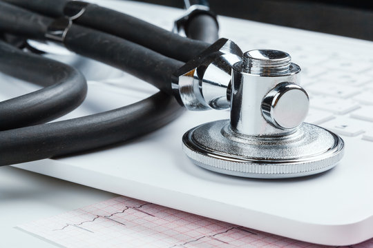 Stethoscope With Laptop on the table